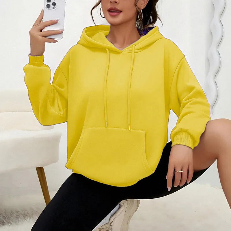 Women's loose fit grey drawstring hood sweatshirt with front pockets, long sleeves
