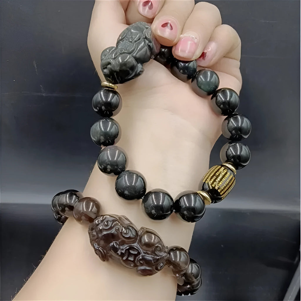 Natural obsidian Heart Sutra bracelet on display with 10mm and 14mm bead options