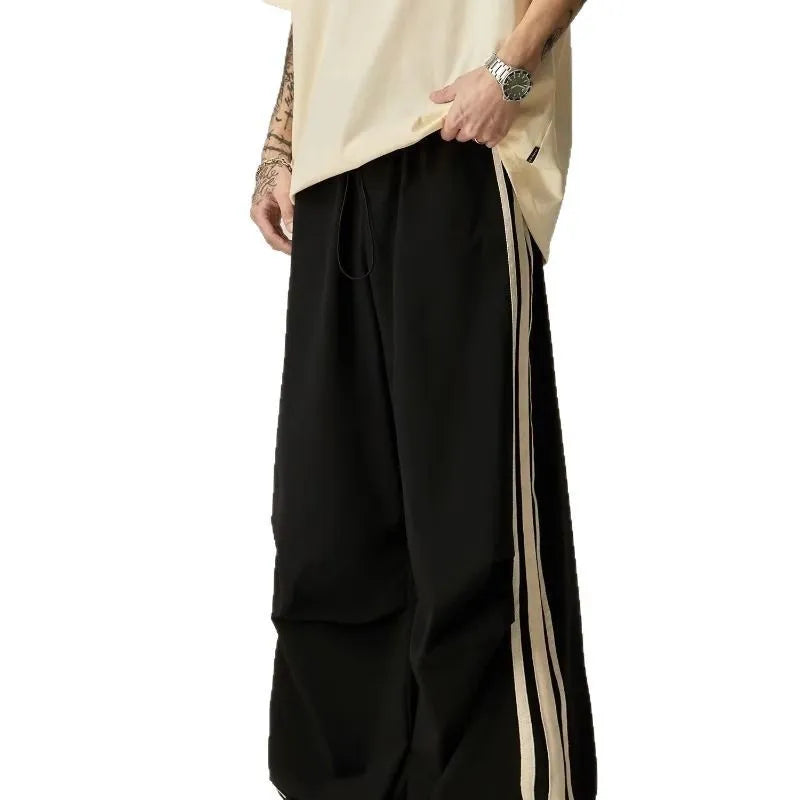 Black wide-leg climbing trousers with high waist design shown flat