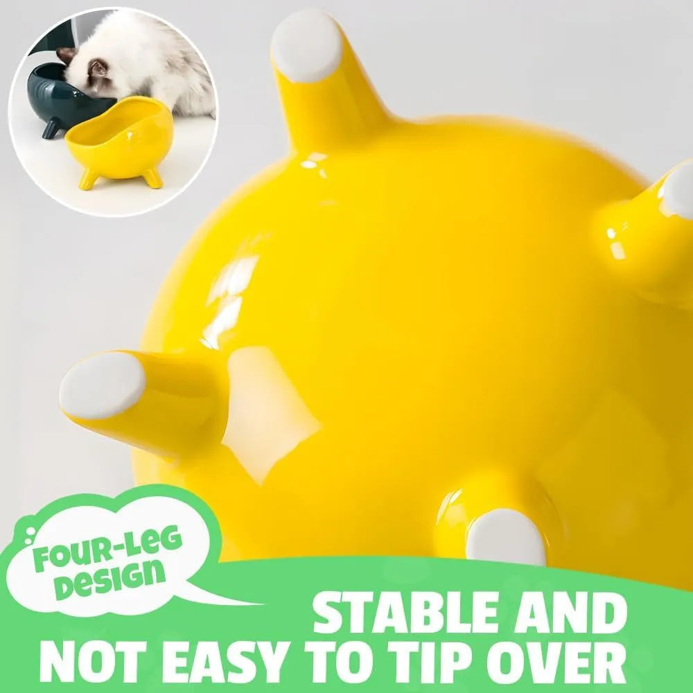 Green four-legged ceramic cat food bowl with elevated base and wide mouth design
