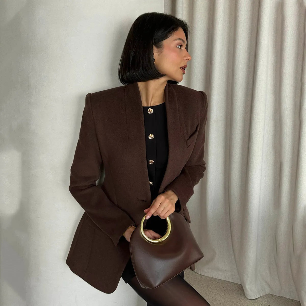 Single button slim fit solid brown polyester fibre suit coat on display