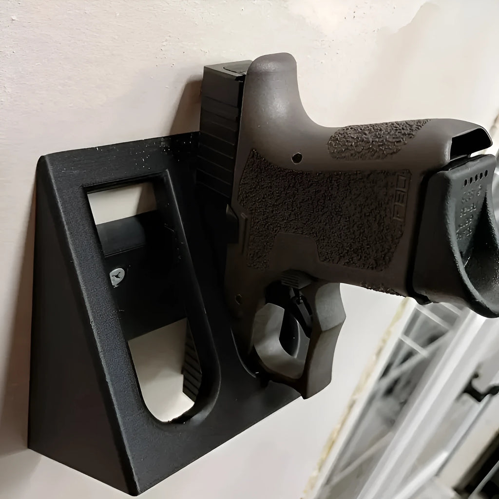 Black punk-style plastic pistol stand for airsoft gun display
