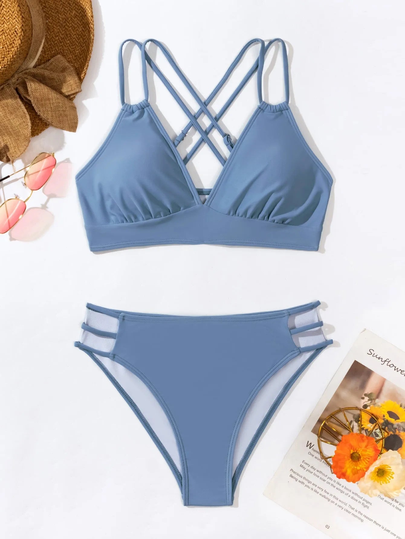 Women's black V-neck halter bikini with removable padded bra and split shorts.