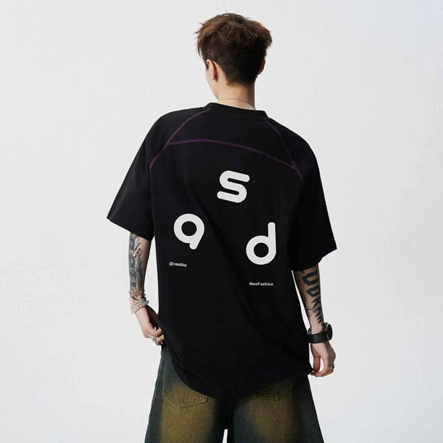Men's loose fit cotton T-shirt with letter print design in black colour showing short sleeves and round neck