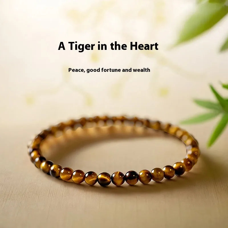 Tigereye bracelet with geometric new Chinese style design showing round beads in natural stone