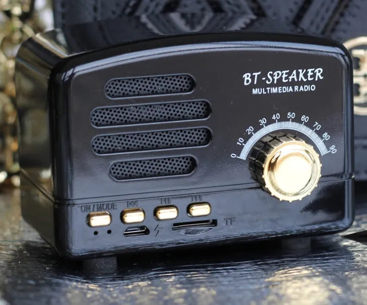 Vintage wood grain Bluetooth speaker with compact dimensions on wooden surface
