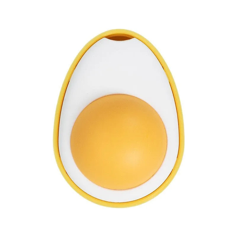 Soft plush catnip ball toy in fried egg shape stuck to a wall, with a cat playing.