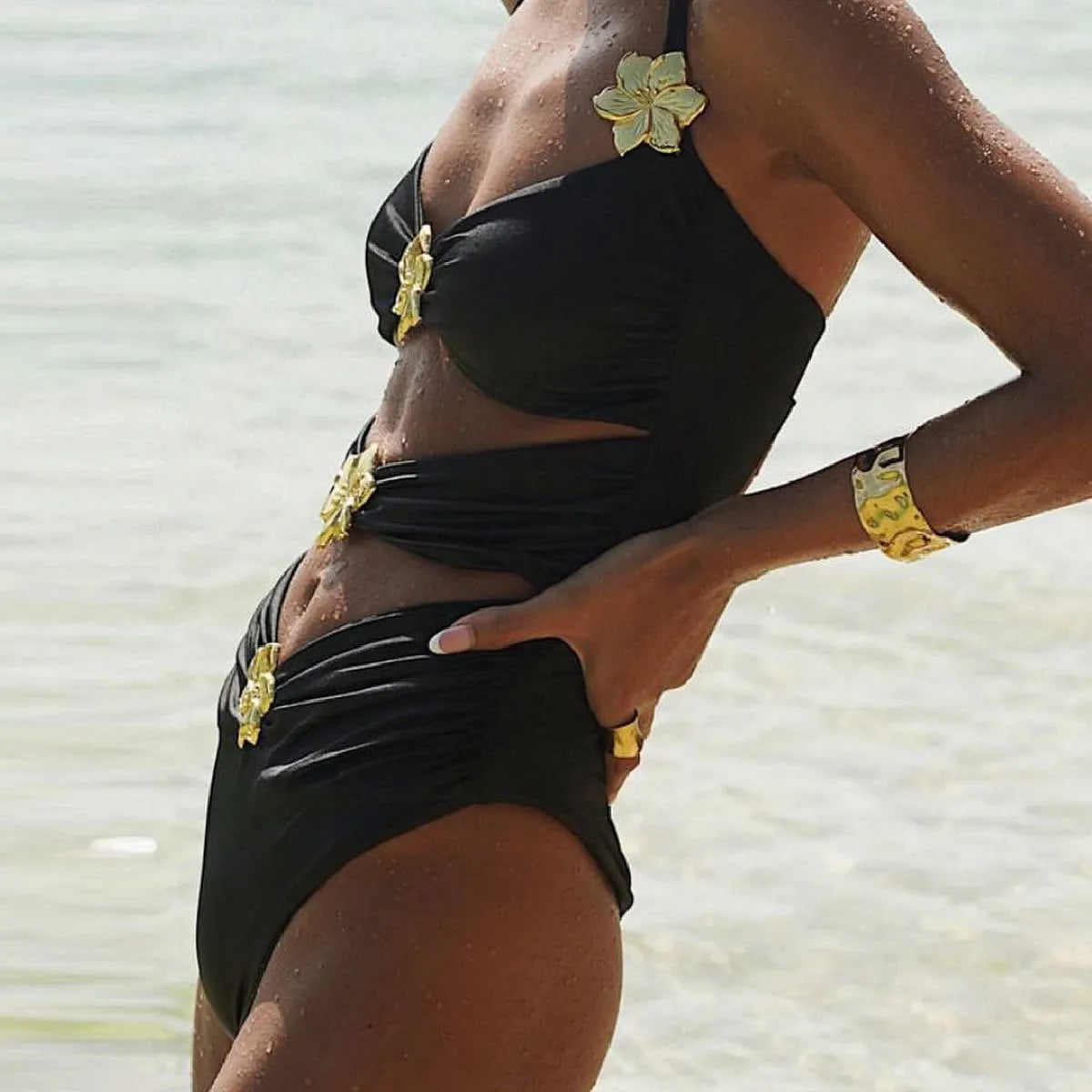 Adult female one-piece swimsuit with hollow-out tube top and matching short skirt in solid colour