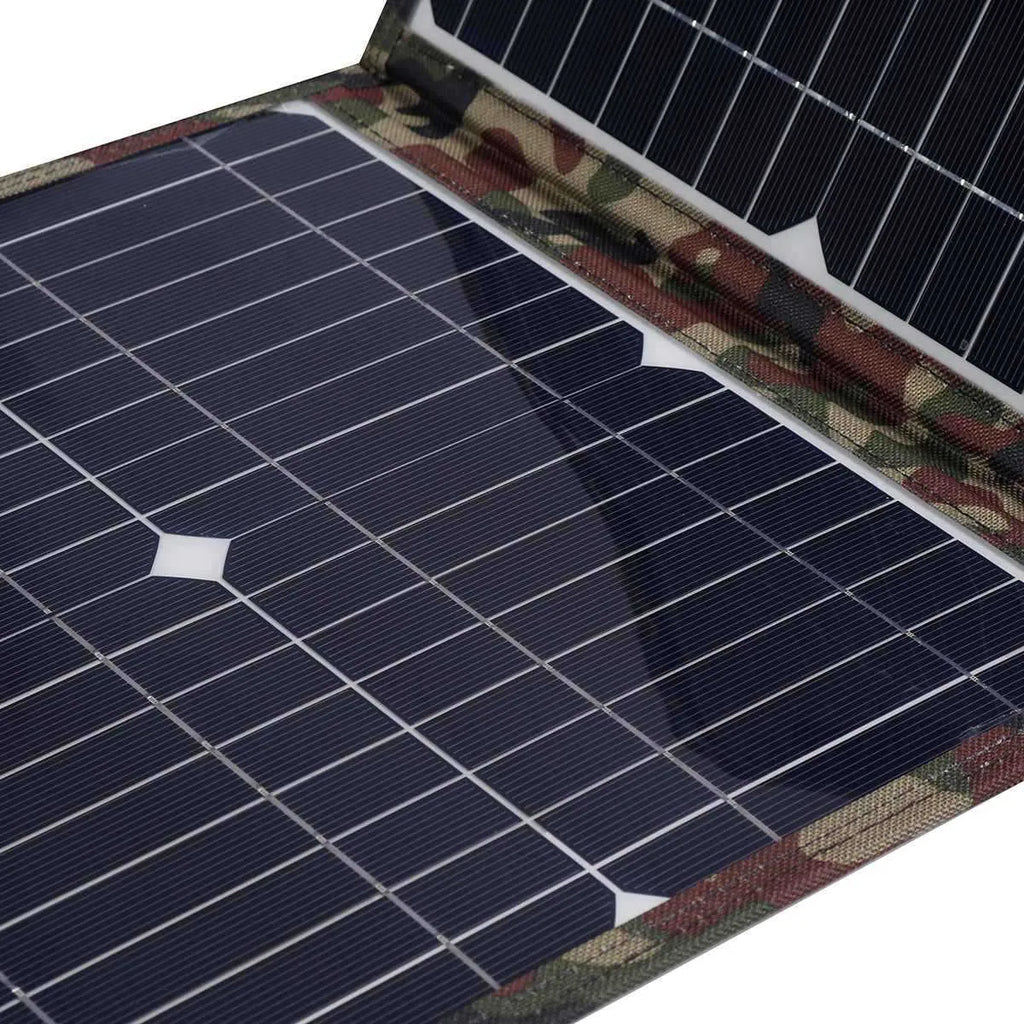 Black foldable 36W portable solar panel unfolded showing three solar cells, with car charger and cables.