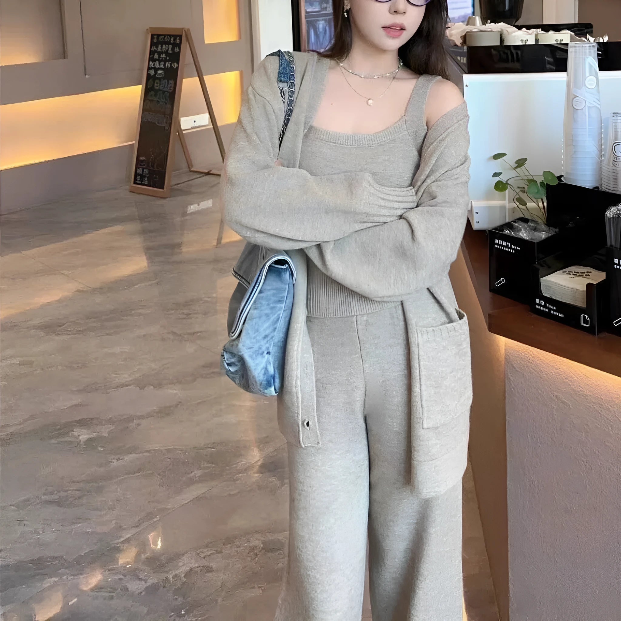 Women's loose fit wool blend cardigan three-piece set in beige, showing vest, coat, and casual pants.