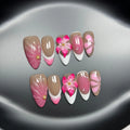 Set of French style artificial nails with white tips and 3D white lily flowers on almond-shaped plastic nail tips.