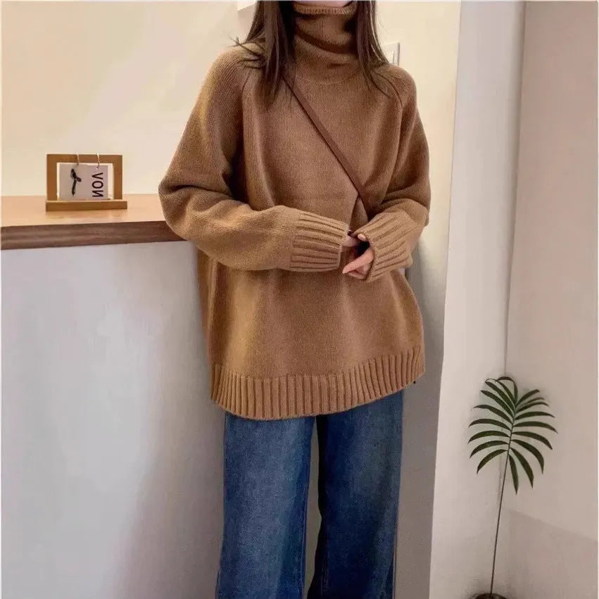 Red loose-fit women's turtleneck sweater with thick knit and a textured curling collar.
