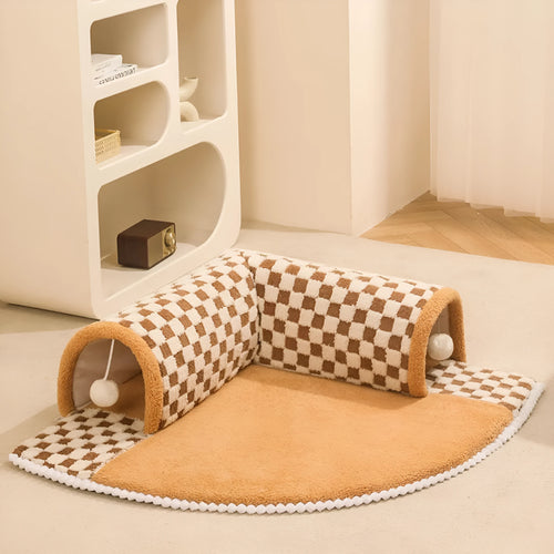 XL coffee coloured plush fan-shaped pet bed with a tunnel for dogs and cats on a wooden floor.