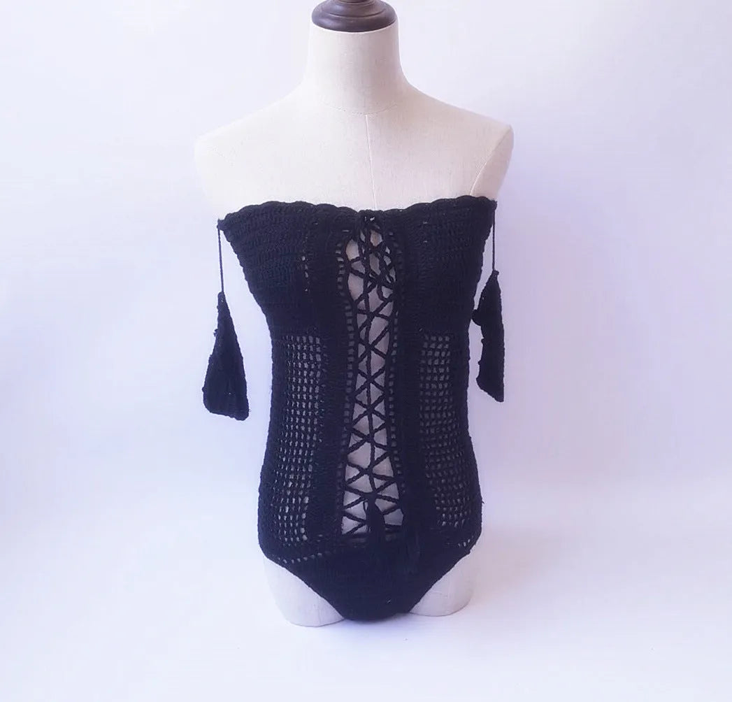 Women's off-shoulder one-piece swimsuit on a mannequin, shown in a light colour.