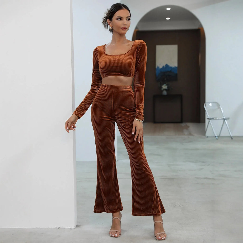 Women's caramel coloured long sleeve sweater and trousers loungewear set on a hanger.