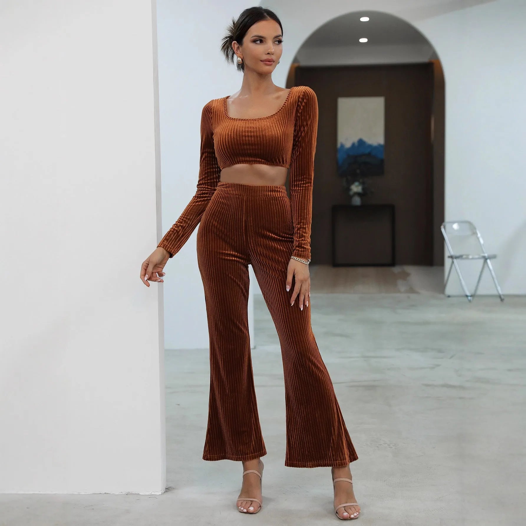 Women's caramel coloured long sleeve sweater and trousers loungewear set on a hanger.