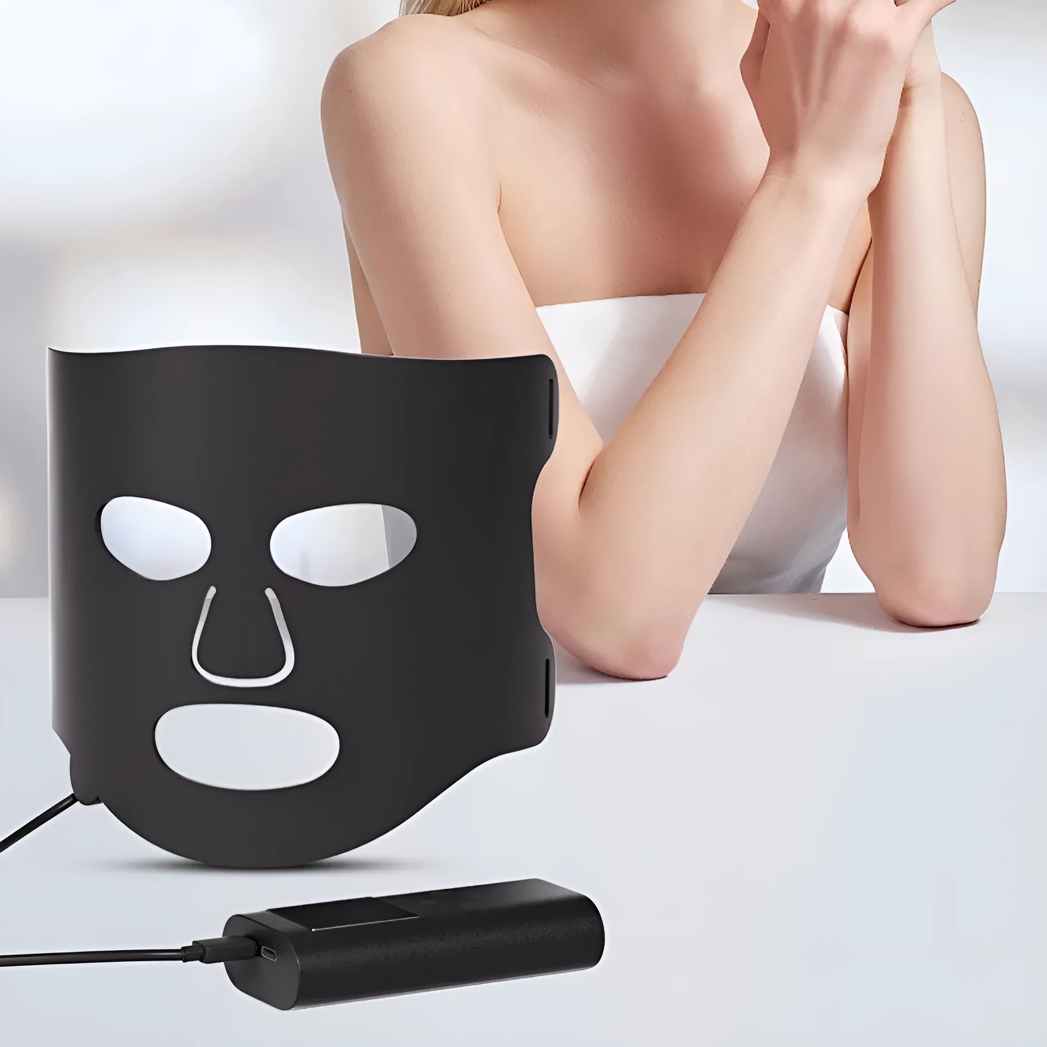 Black and gold LED phototherapy face mask with seven colour light modes for home skincare treatment.