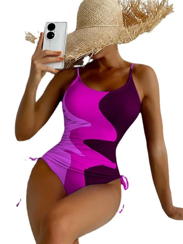 Blue women's sleeveless one-piece swimsuit with fixed swimming trunks on a mannequin.