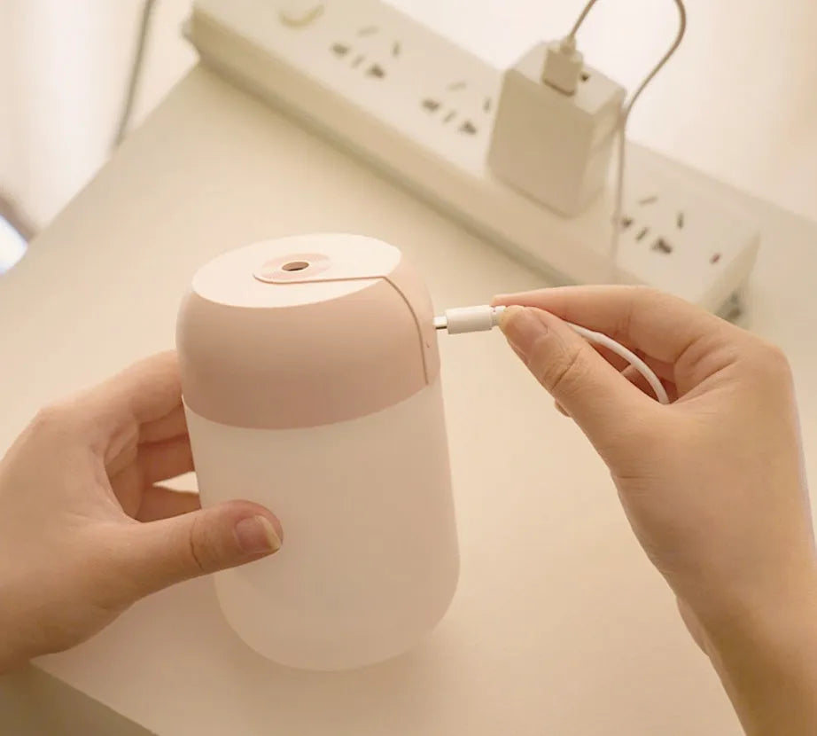 White cylindrical mini humidifier with USB cable for small room aromatherapy and humidification