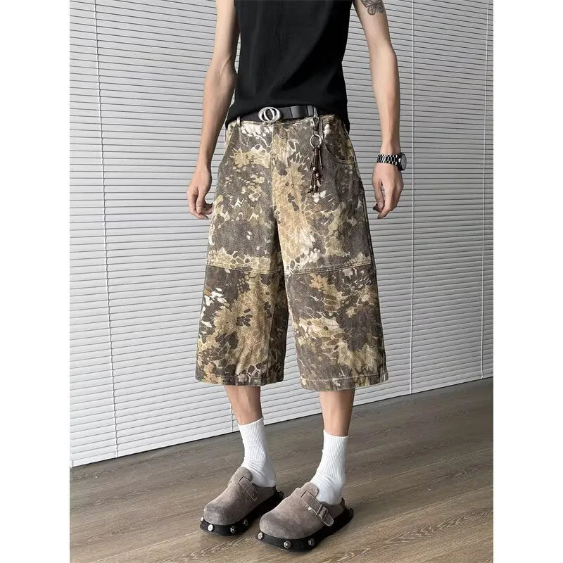 Yellow snake camouflage cropped jeans on a denim background