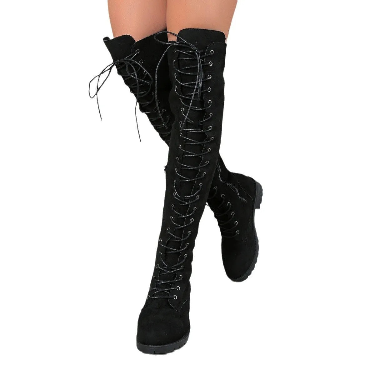 Black lace-up over-the-knee boots with a flat rubber sole and decorative stitching on the faux leather upper