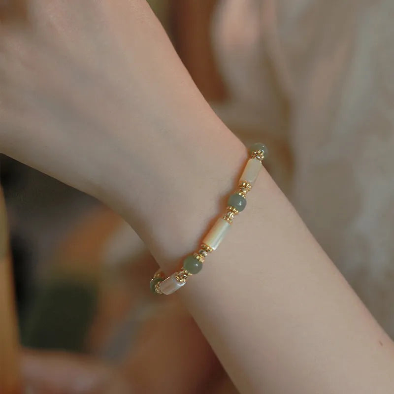 Natural Hetian Jade white lip shell bracelet for women with round beads and geometric design