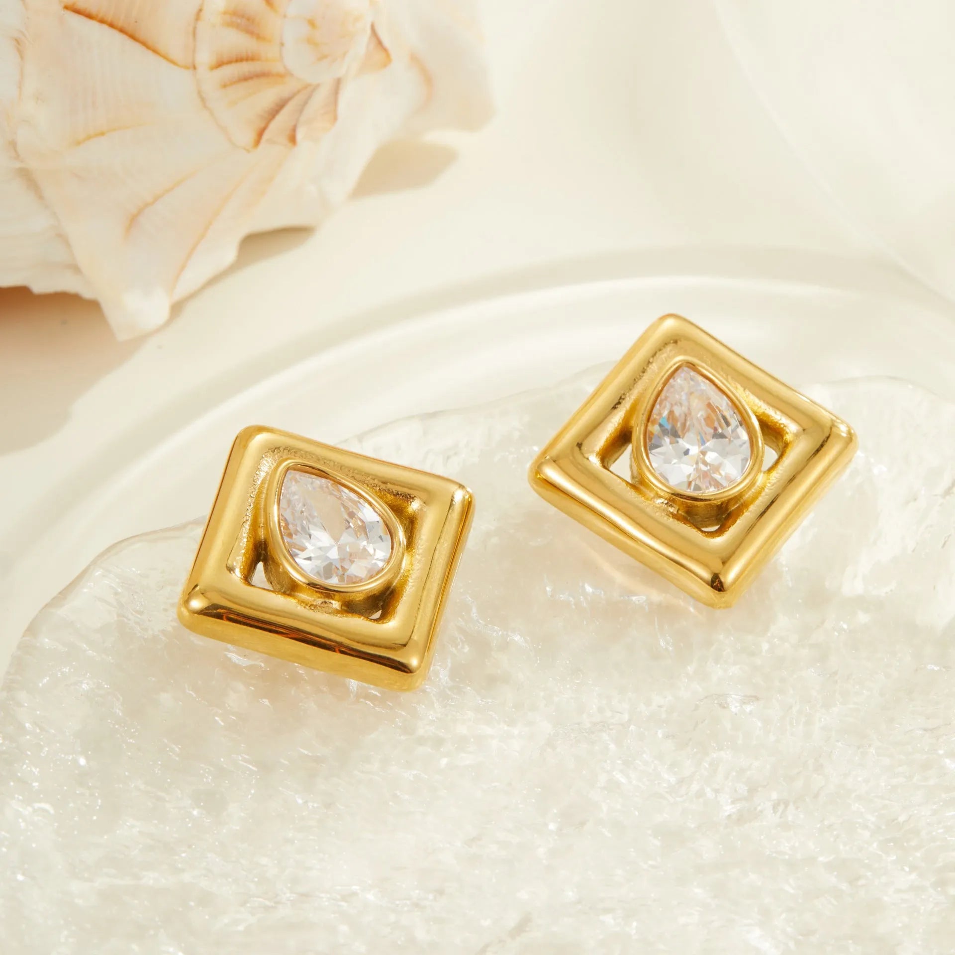 Gold geometric water drop zircon stud earrings with butterfly back fastenings
