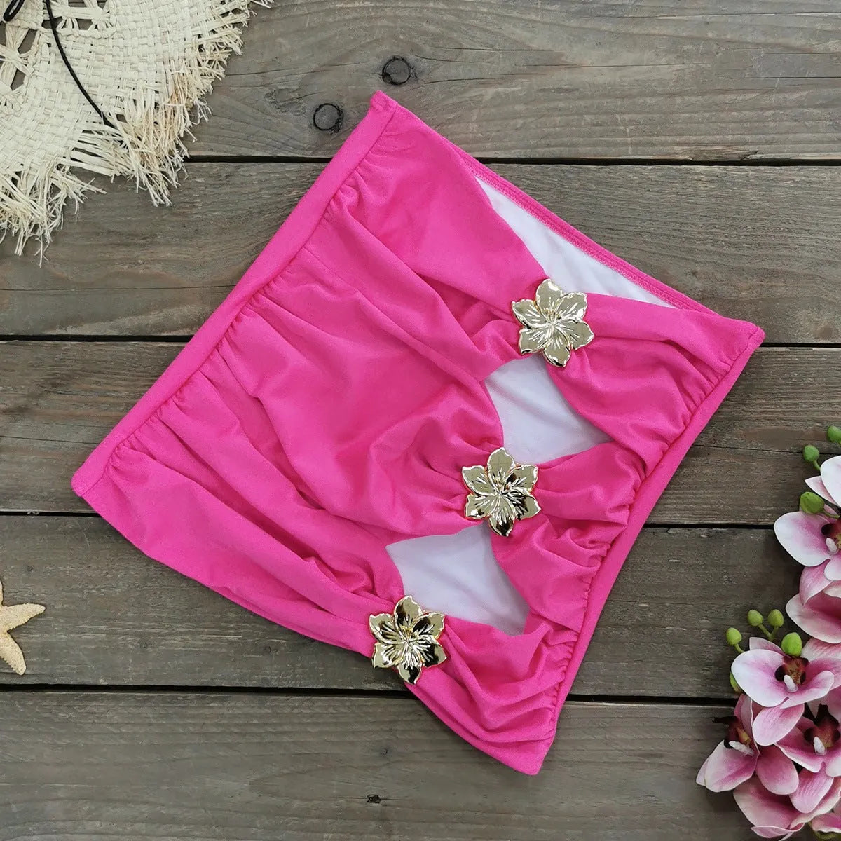 Adult female one-piece swimsuit with hollow-out tube top and matching short skirt in solid colour