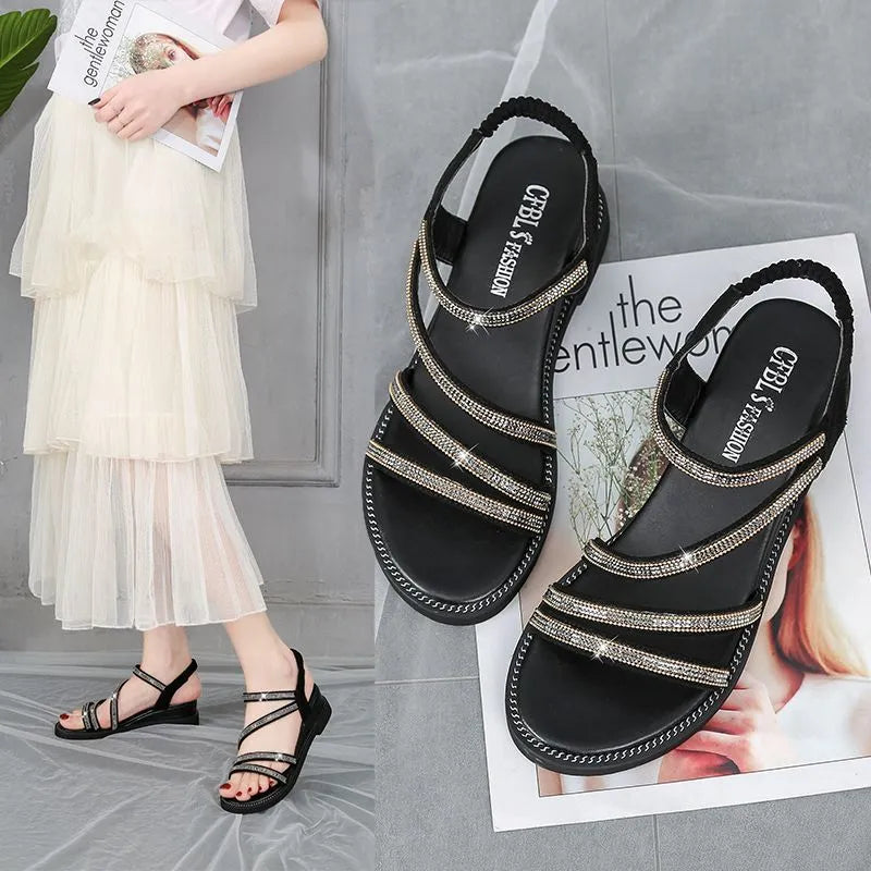 Women's gold Korean style flat sandals with rhinestone fairy details and an elastic strap.