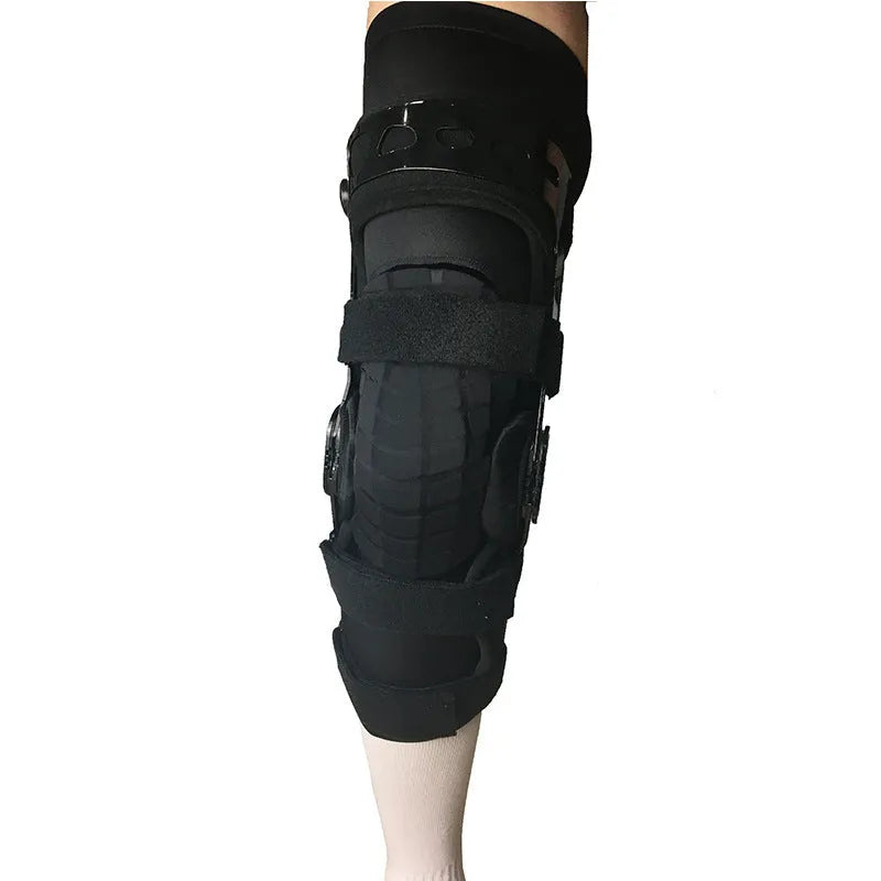 Black anterior ligament knee supporter showing sponge padding and brushed cloth lining, with size tags for left and right legs.