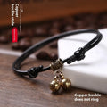 Small dog wearing adjustable nylon rope collar with brass bell in black, red, or coffee colour