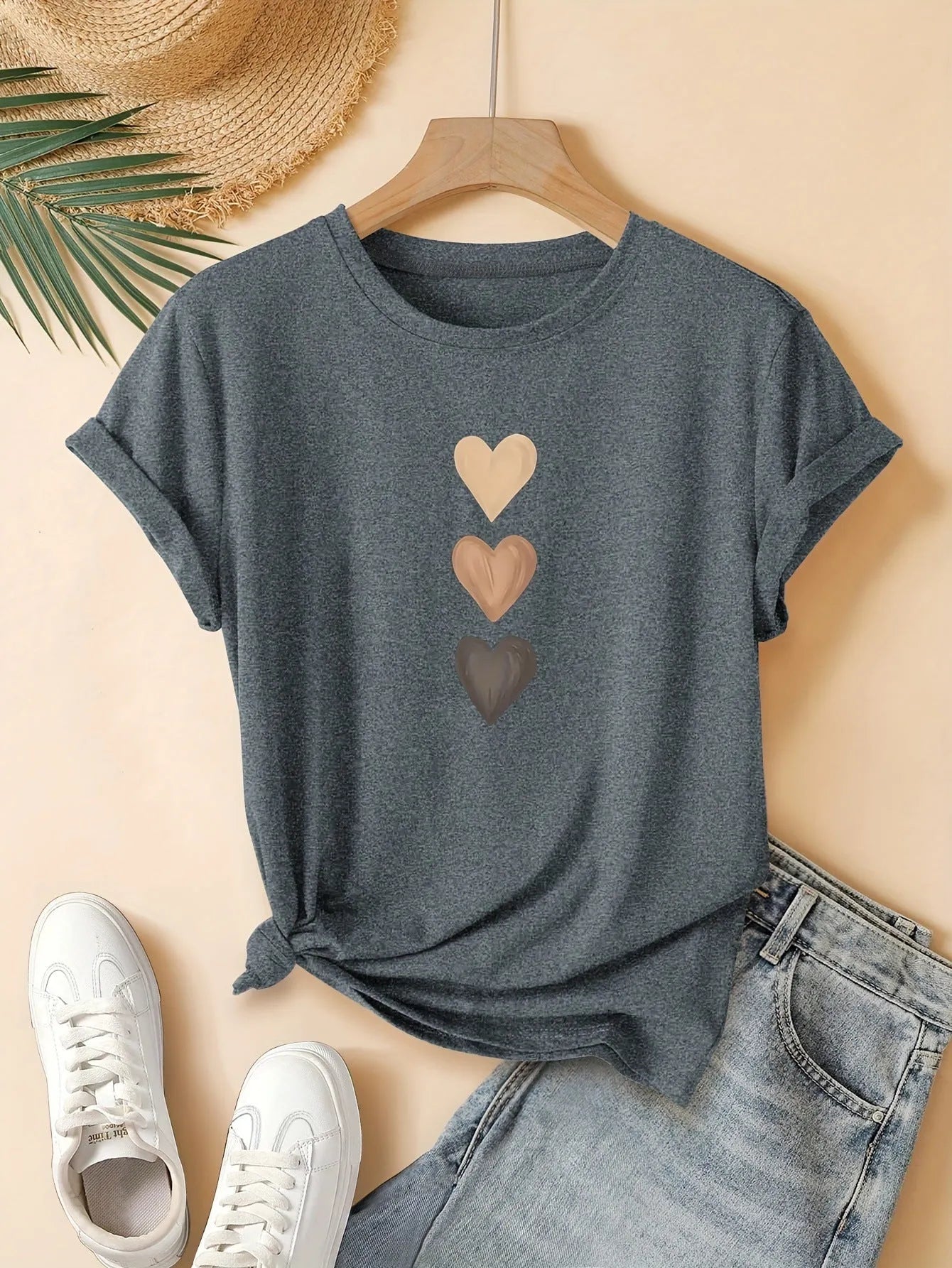 Women's art retro style printed cotton short sleeve T-shirt on a hanger.