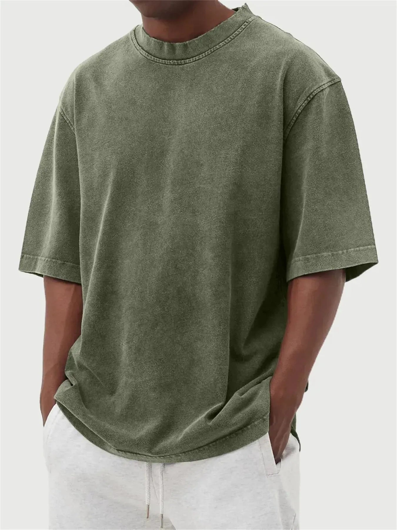Men's loose fit distressed stone wash pullover t-shirt in solid colours like army green and blue.