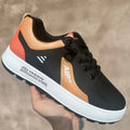 Men's white and orange breathable casual sports shoes with a round toe and artificial PU upper.