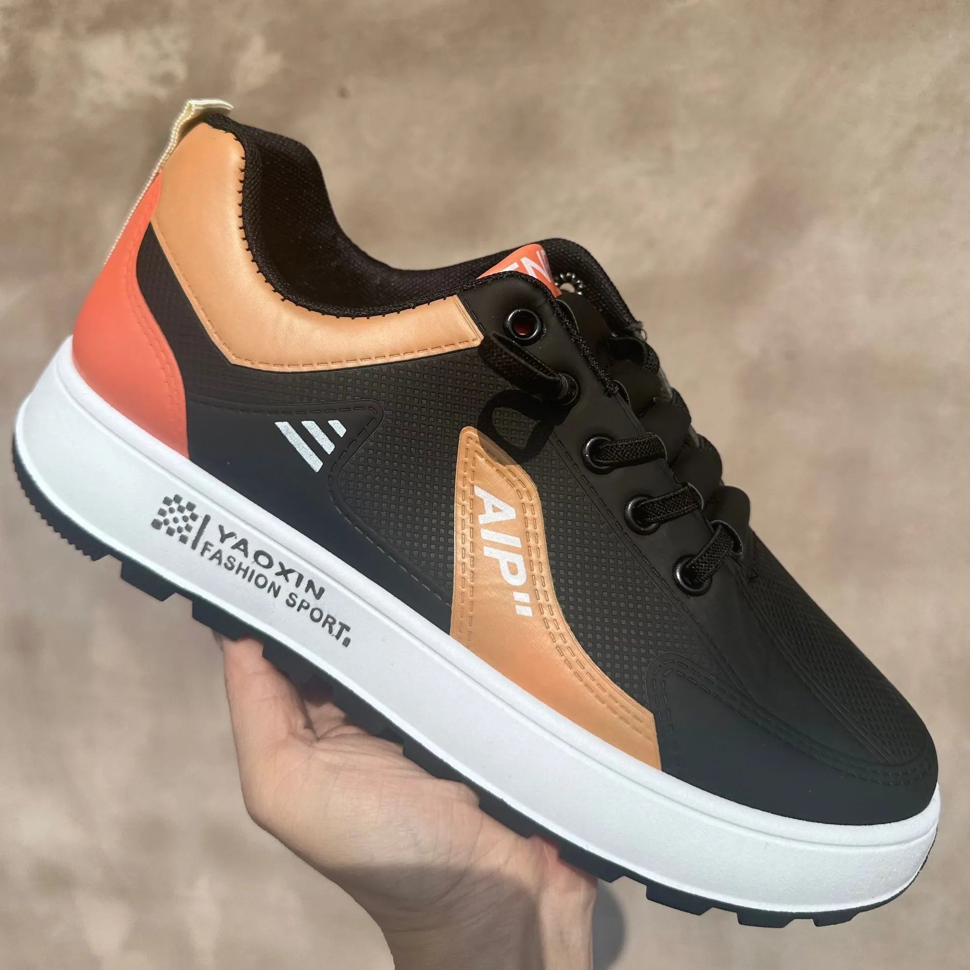 Men's white and orange breathable casual sports shoes with a round toe and artificial PU upper.