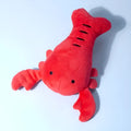 Red lobster stuffed squeaky dog toy for small medium breeds on white background