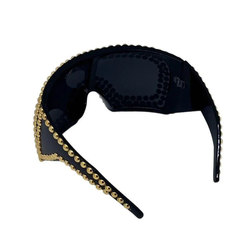 Men's punk style square sunglasses with large rim and rivet detailing in gold colour