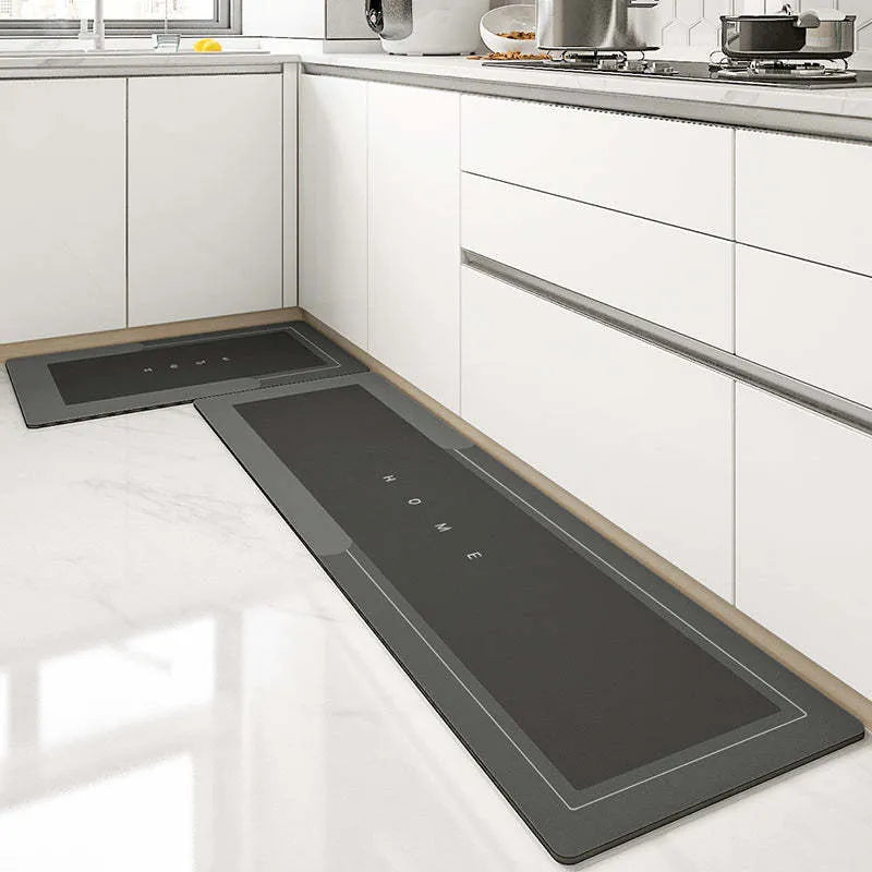 Blended fabric bathroom floor mat in blue colour, shown in an oval shape on a tiled floor.