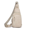Women's small brown PU leather chest bag with open front pocket worn across chest