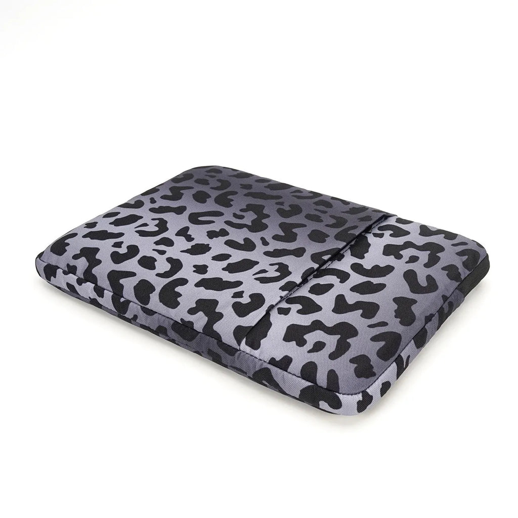 Leopard print laptop sleeve with waterproof polyester exterior and protective flannel lining