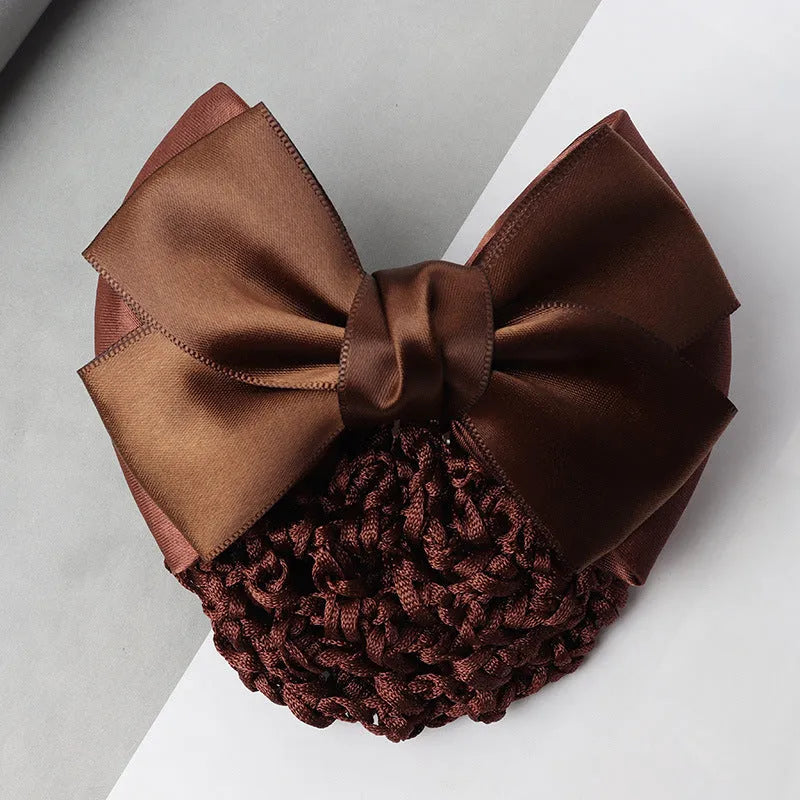 Professional hair clip with a black net pocket and a red flower bow ornament on a white background.
