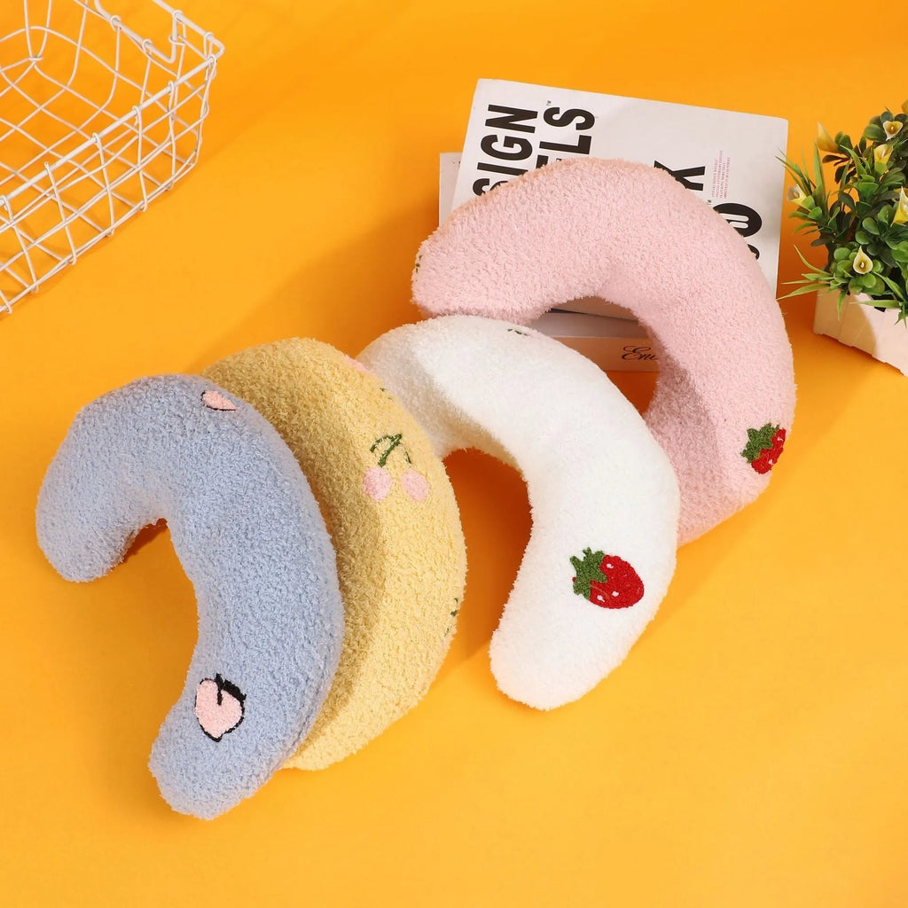 Half moon U-shaped cat pillow with cartoon dog and cat print in blue, pink, white, or yellow.