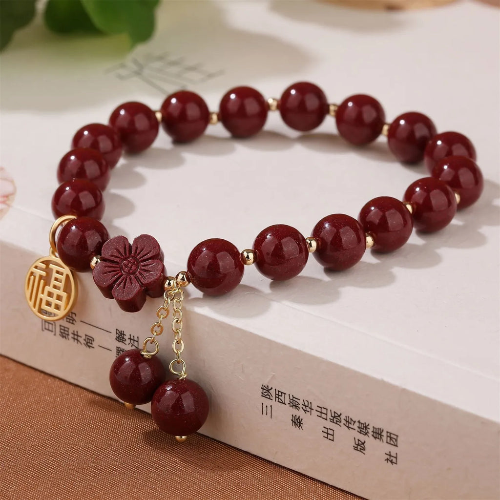 Retro national style cinnabar bracelet with purple gold sand, fu character and peach blossom motifs