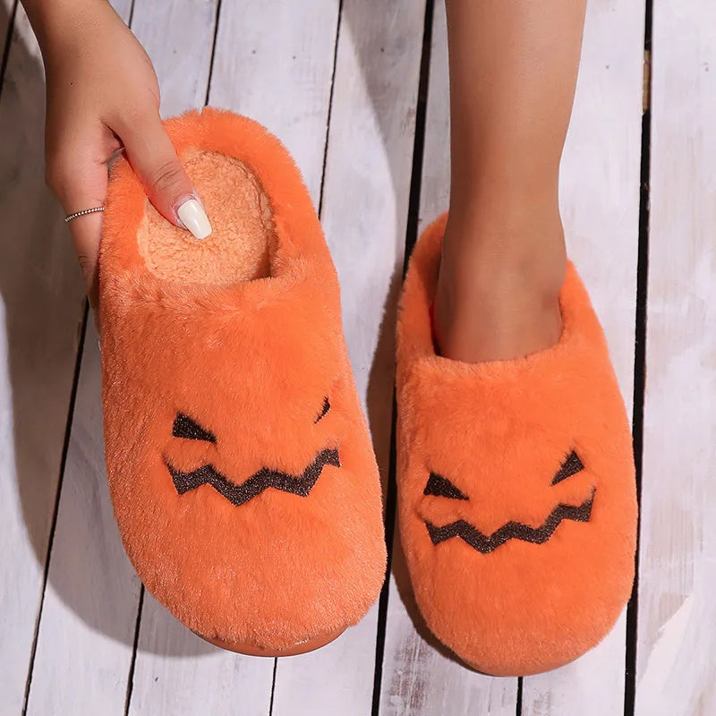 Orange pumpkin design Halloween slippers with plush lining and PVC sole for indoor home wear