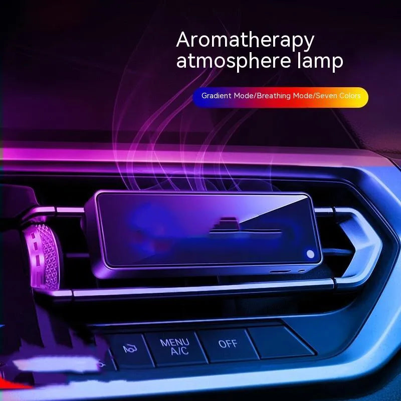 Black car air vent aromatherapy diffuser with LED light showing fragrance stick compartment