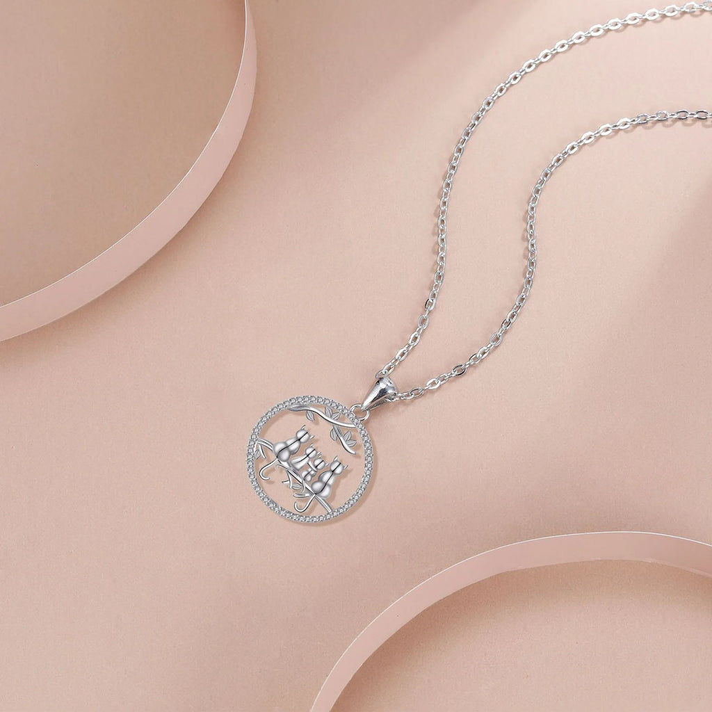 Copper necklace with four kitten pendant on cross chain, electroplated finish