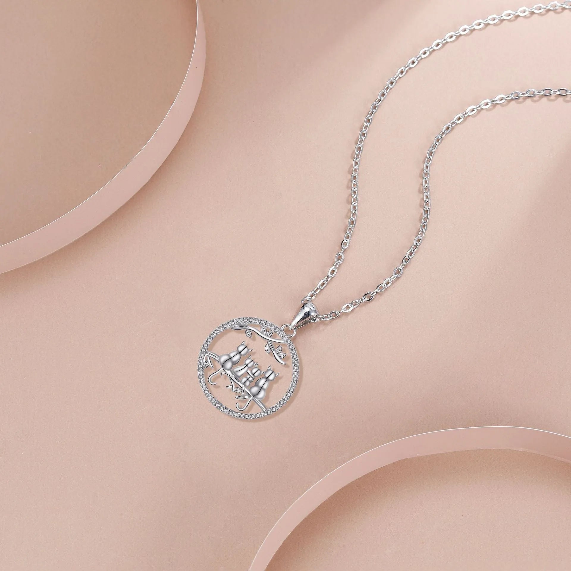 Copper necklace with four kitten pendant on cross chain, electroplated finish