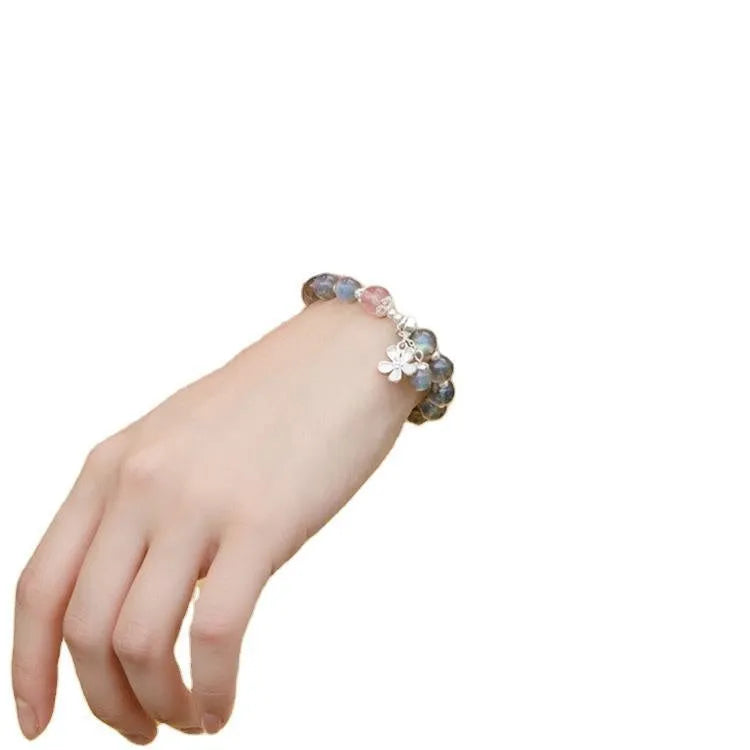 Women's 925 silver bracelet with grey moonlight stones and a honeysuckle animal charm.