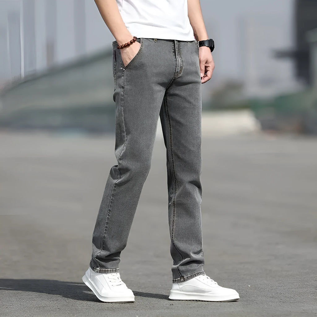 Men's straight leg jeans in smoky grey colour with a low waist and zipper fly