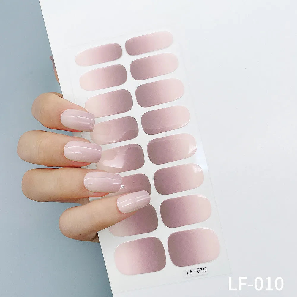 Full nail art sticker sheet showing 16 different solid colour designs including European simple nails and floral patterns
